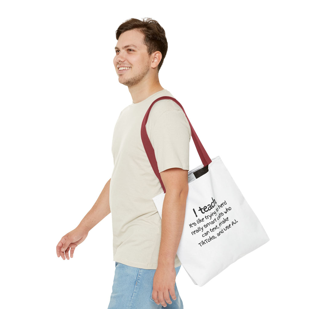 Teacher Tote Bag — “I teach. It’s like trying to herd really smart cats who can text, make TikToks, and use AI.”