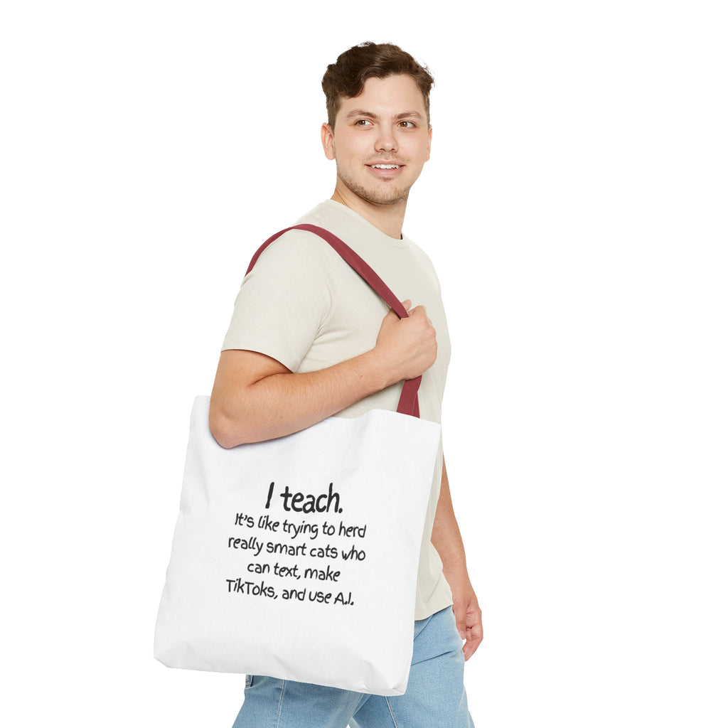Teacher Tote Bag — “I teach. It’s like trying to herd really smart cats who can text, make TikToks, and use AI.”