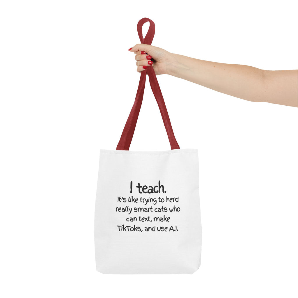 Teacher Tote Bag — “I teach. It’s like trying to herd really smart cats who can text, make TikToks, and use AI.”