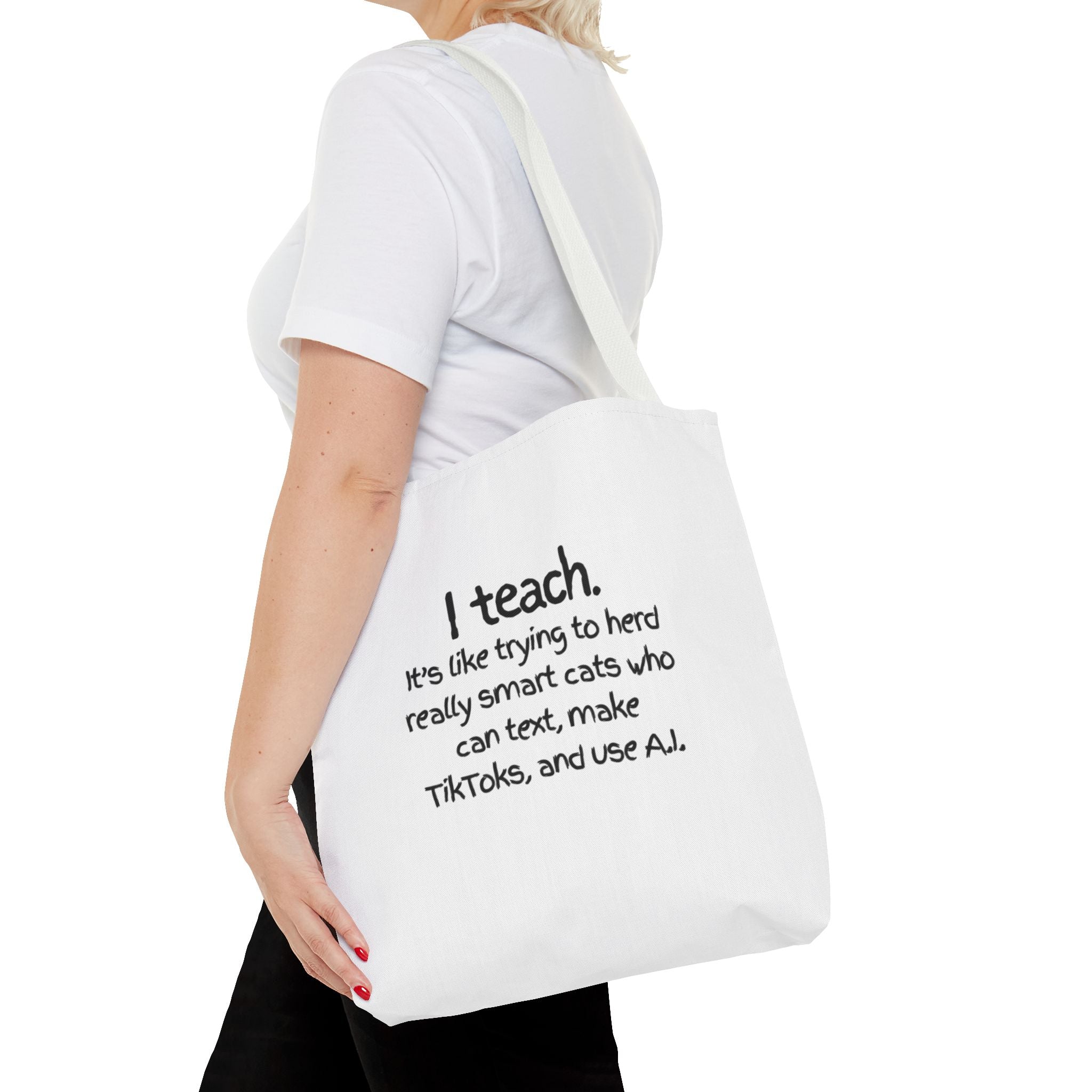 Teacher Tote Bag — “I teach. It’s like trying to herd really smart cats who can text, make TikToks, and use AI.”