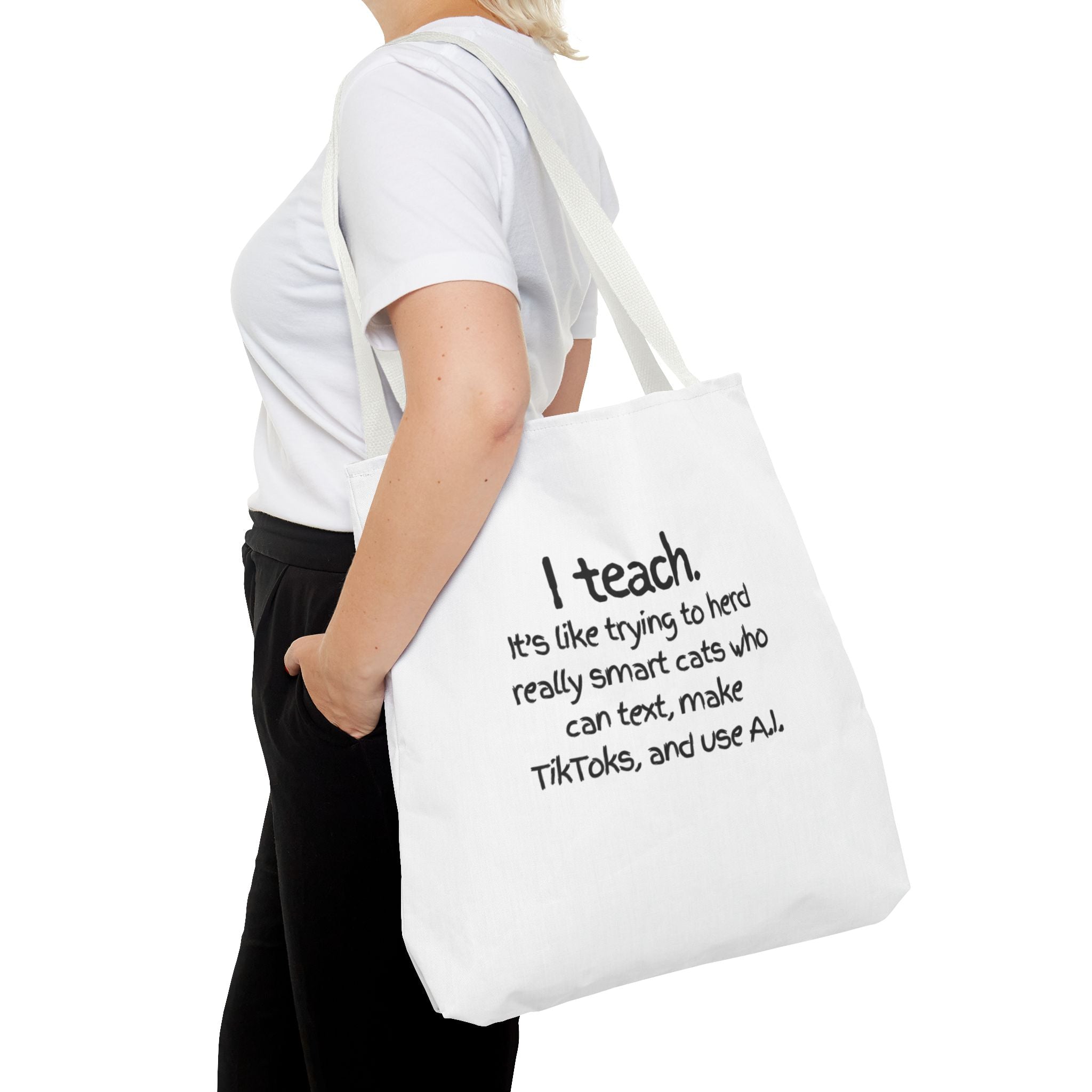 Teacher Tote Bag — “I teach. It’s like trying to herd really smart cats who can text, make TikToks, and use AI.”