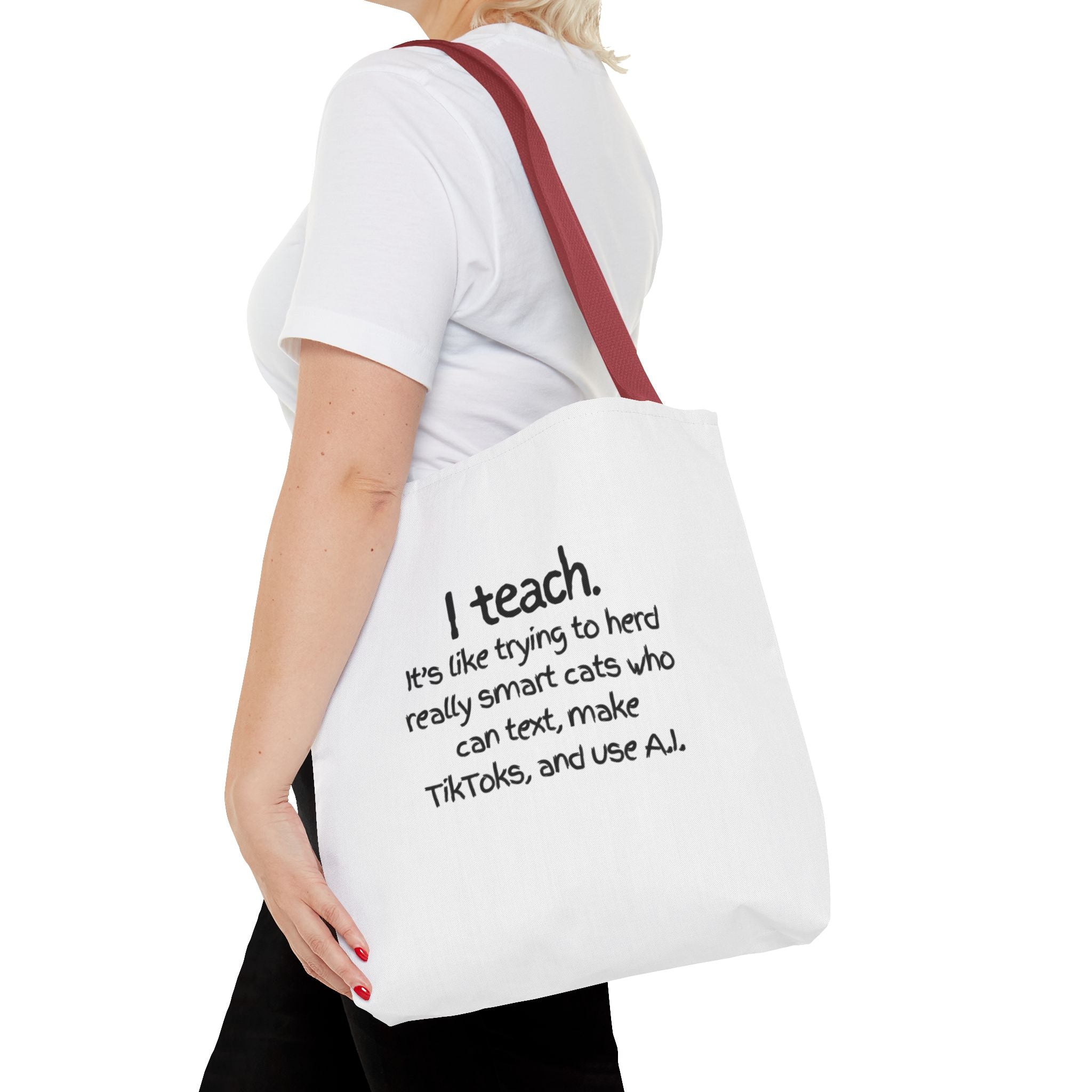 Teacher Tote Bag — “I teach. It’s like trying to herd really smart cats who can text, make TikToks, and use AI.”