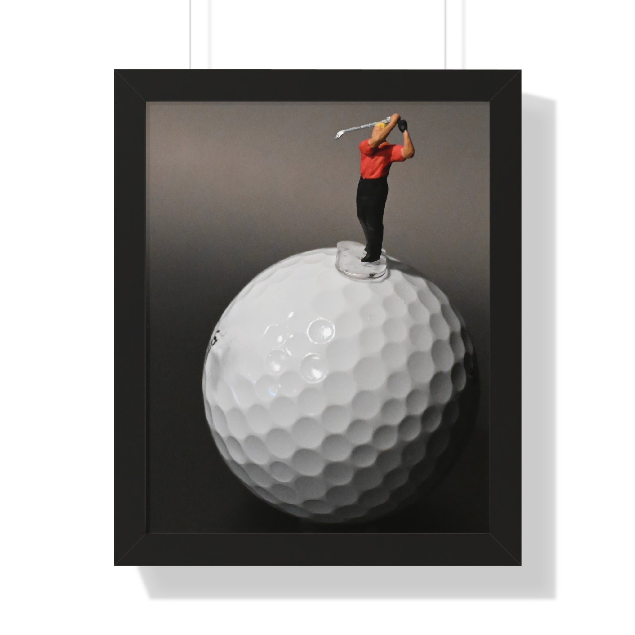 Golf Swing Framed Poster — Miniature Golfer on Giant Golf Ball (Vertical)