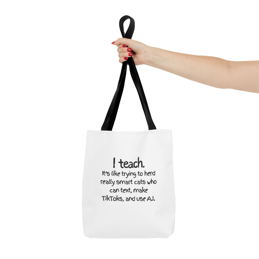 Teacher Tote Bag — “I teach. It’s like trying to herd really smart cats who can text, make TikToks, and use AI.”