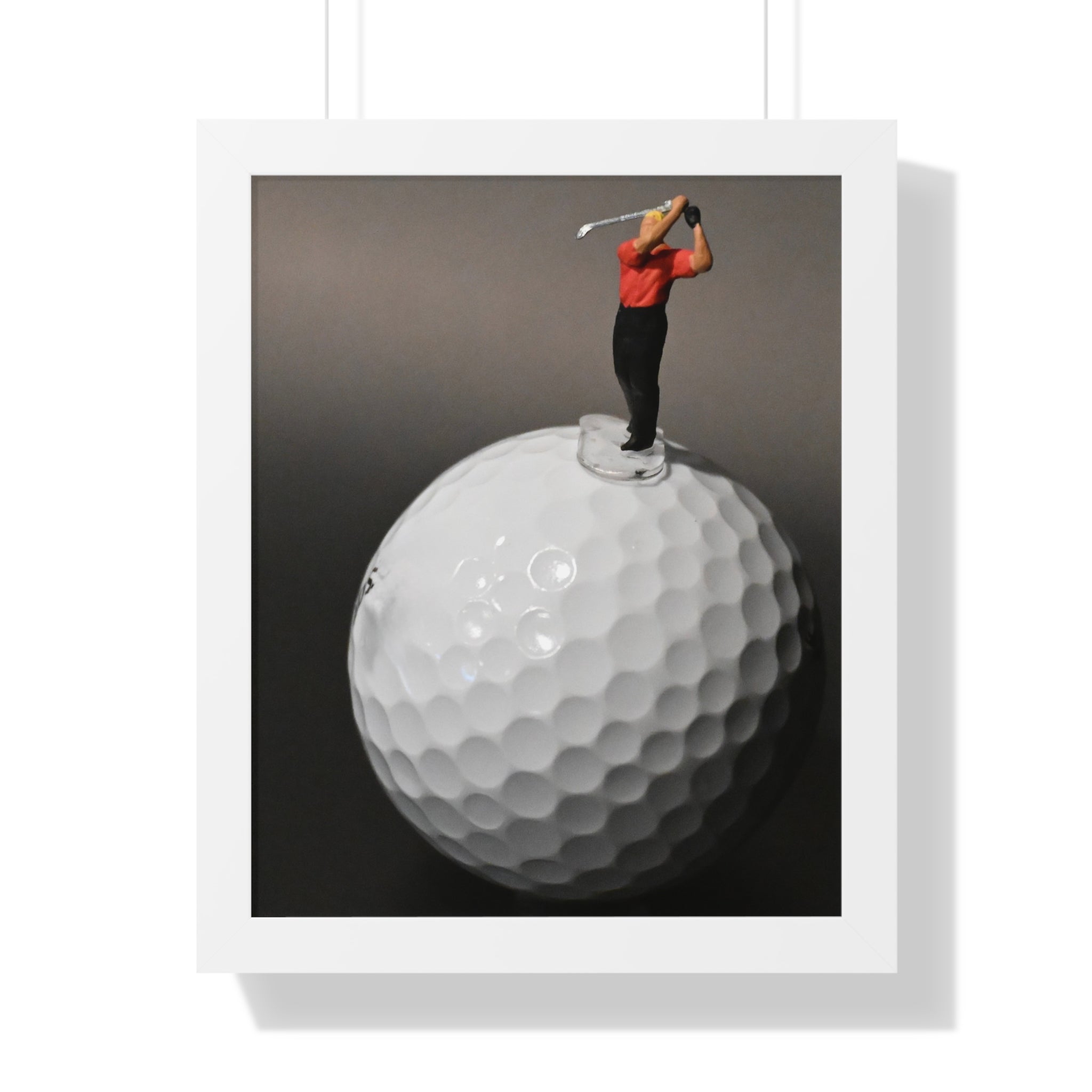 Golf Swing Framed Poster — Miniature Golfer on Giant Golf Ball (Vertical)